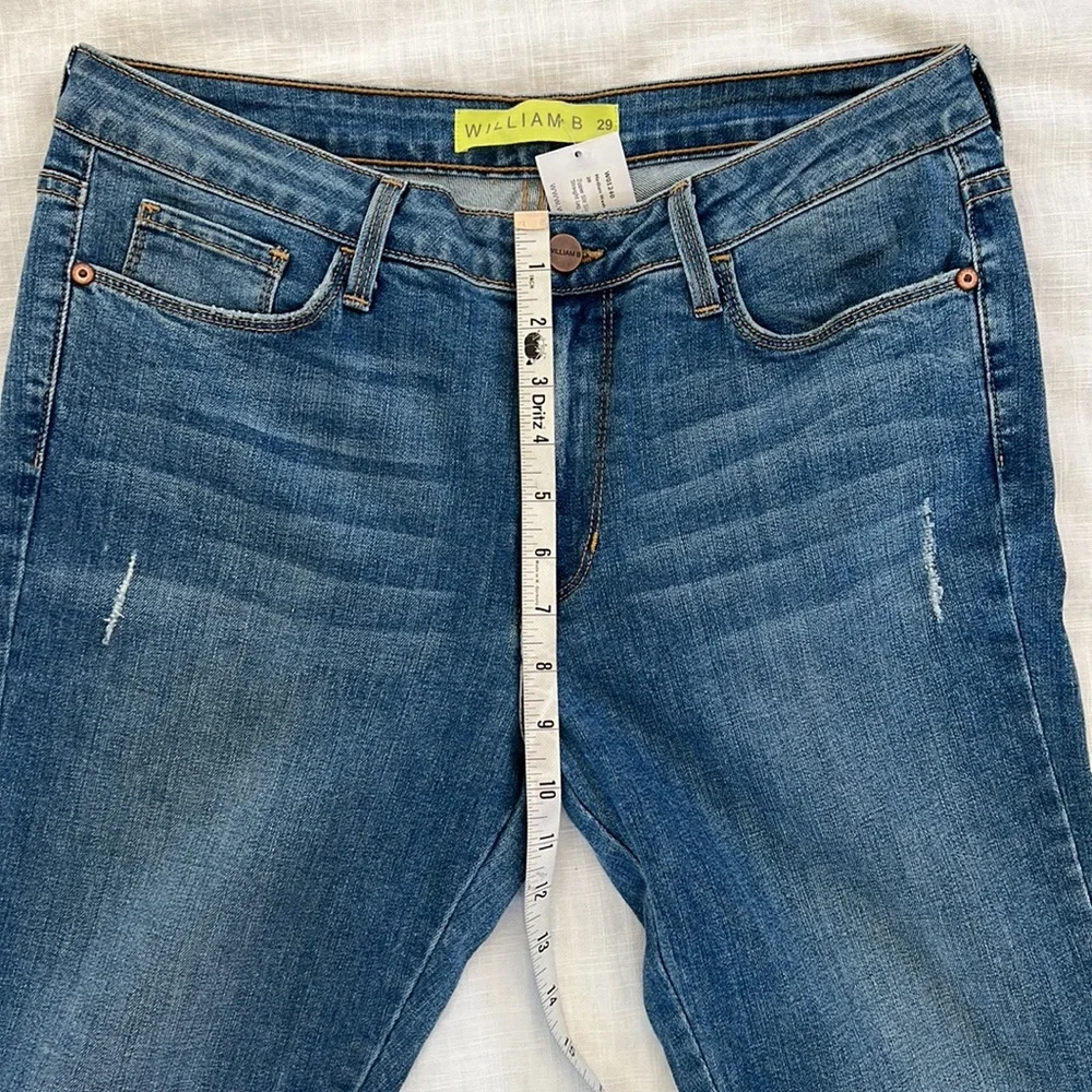 William B size 29 medium wash zipper slit slim straight leg jean. New with tag